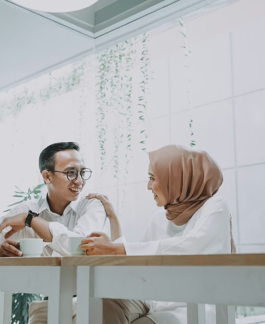 A Muslim couple in warm conversation